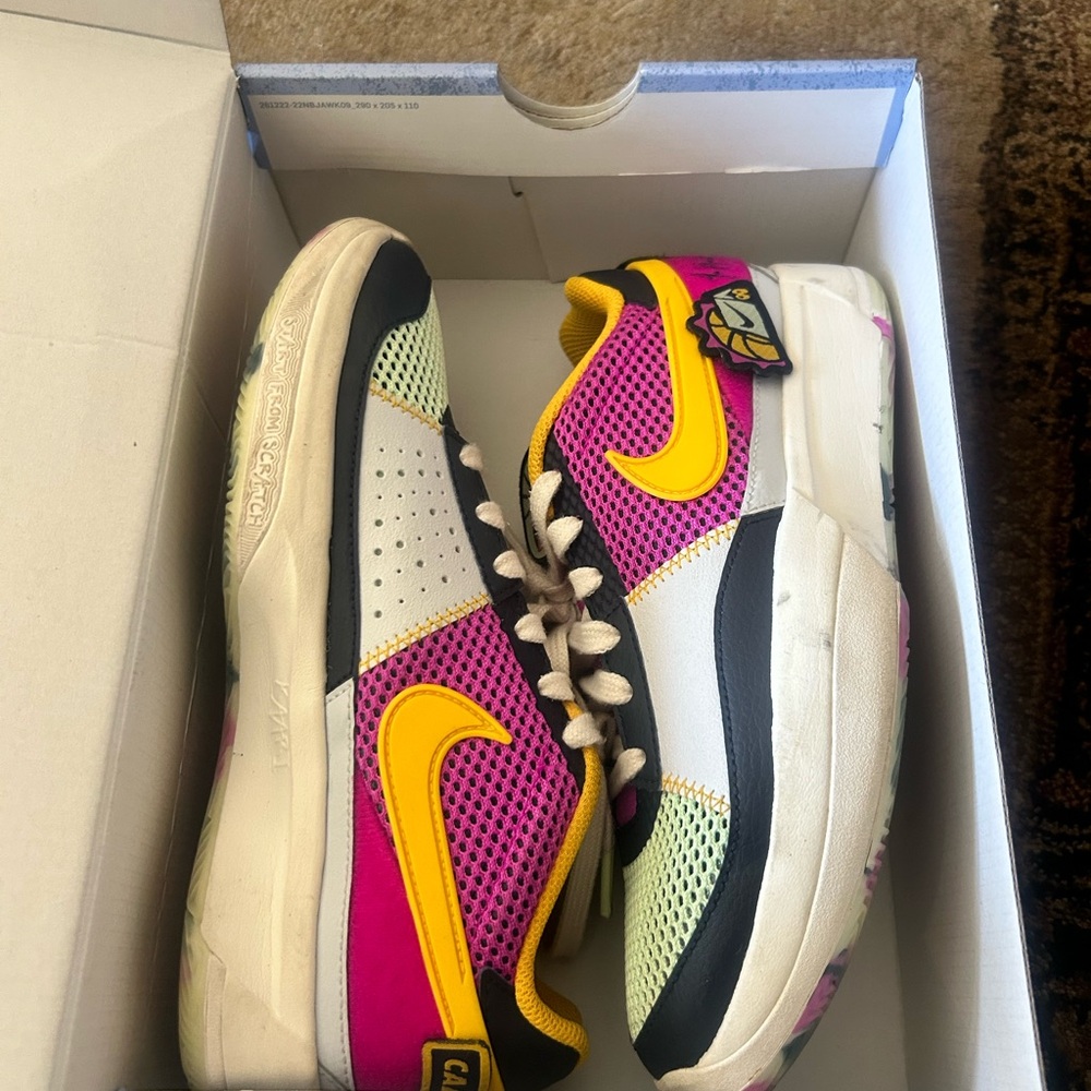 Nike Kids Sneakers - Pink, Yellow, and White. Perfect for basketball season.